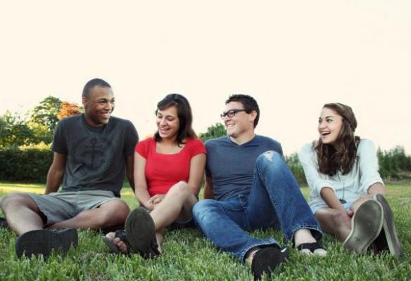 friends sitting in grass