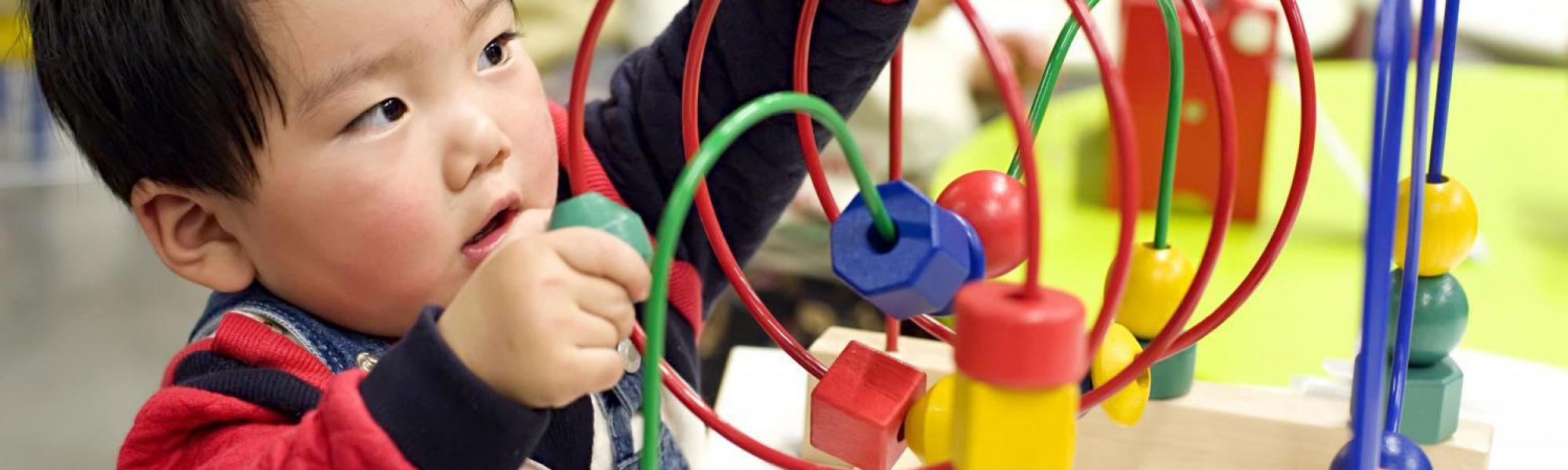 toddler playing with toy